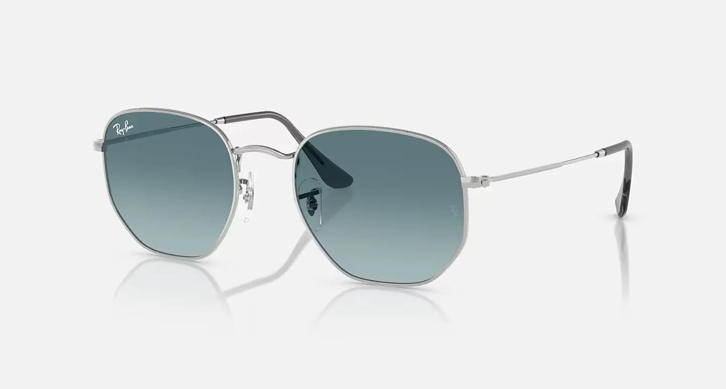 Ray-Ban Hexagonal RB 3548-N sunglasses with thin metal frame and green gradient lenses for stylish UV protection.