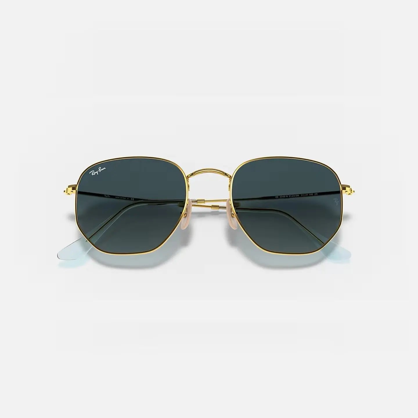 Ray-Ban Hexagonal RB 3548-N sunglasses with thin gold metal frame and green G-15 lenses providing UV400 protection.