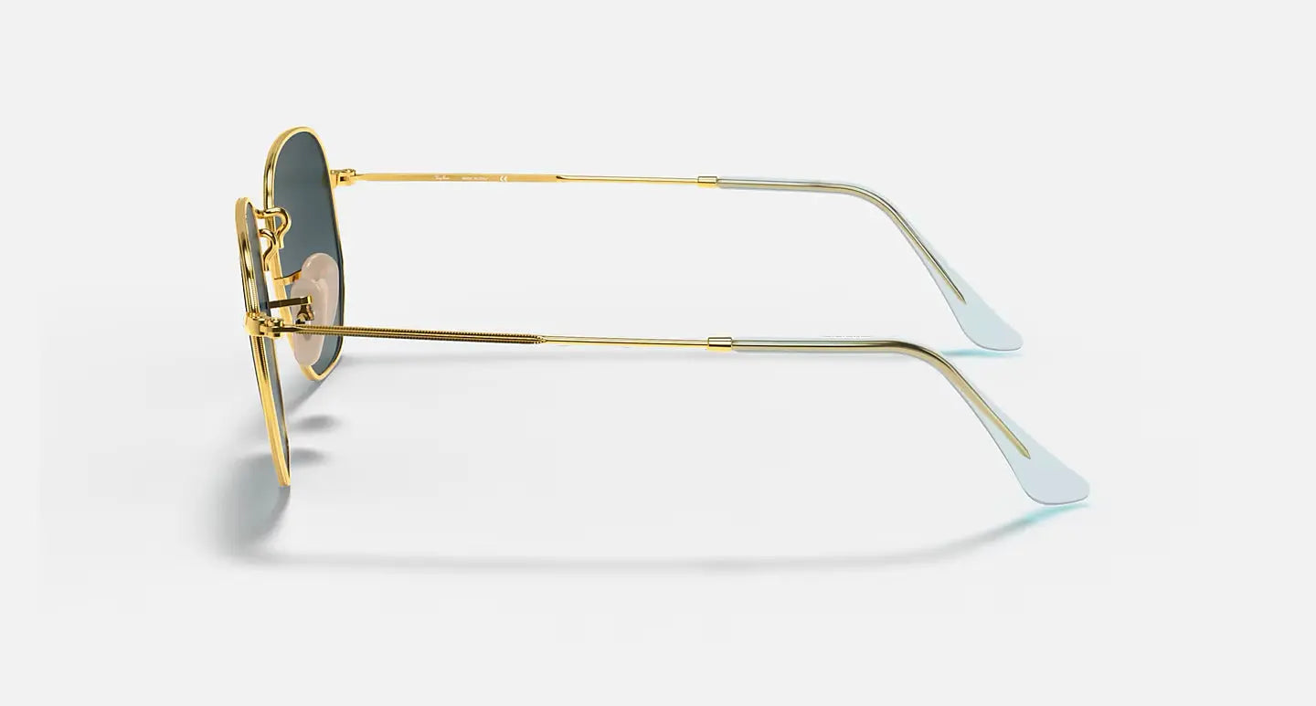 Ray-Ban Hexagonal RB 3548-N metal frame sunglasses with gold temples and green G-15 lenses side view.