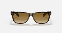 Ray-Ban New Wayfarer RB2132 sunglasses with glossy tortoise acetate frame and brown gradient lenses.