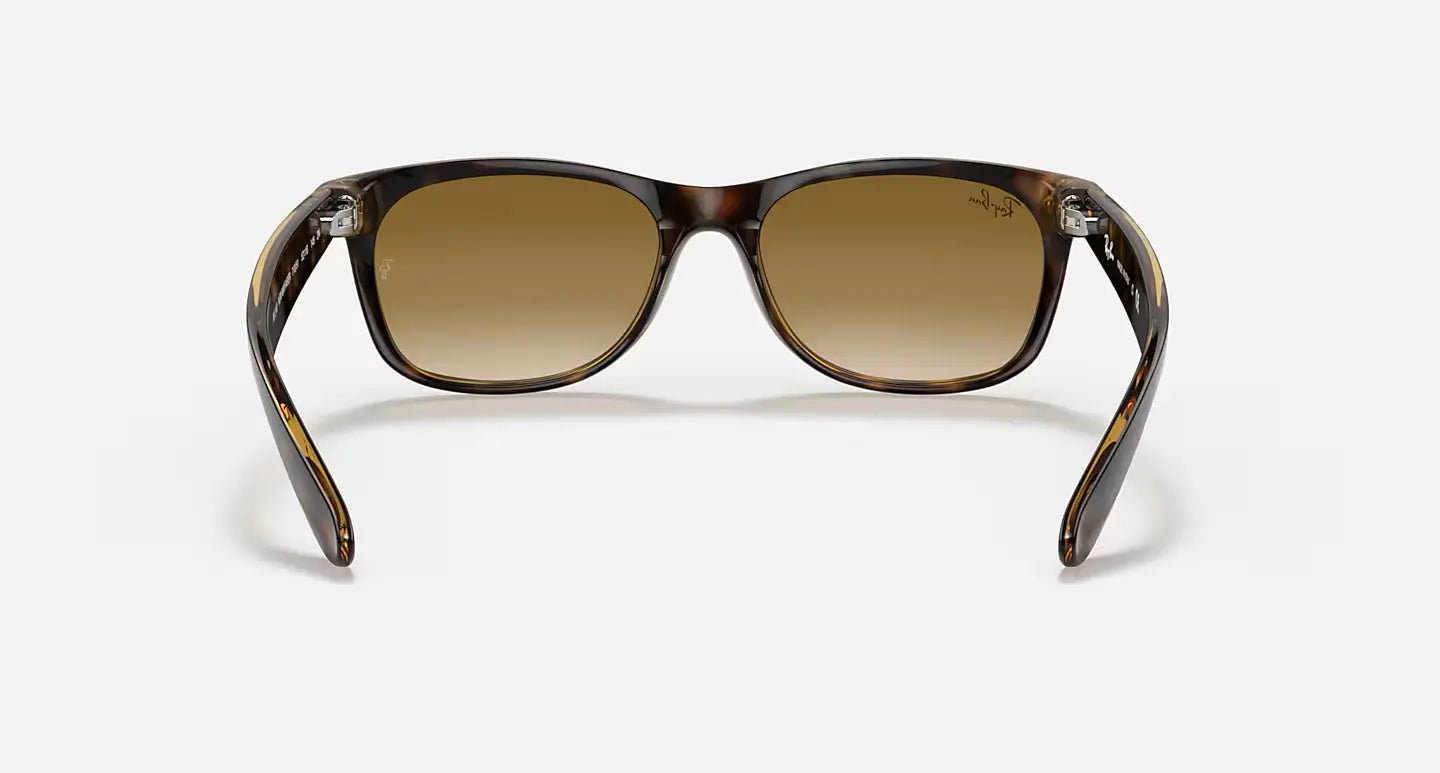 Ray-Ban New Wayfarer RB2132 sunglasses with glossy black frame and brown gradient lenses, classic and modern style.